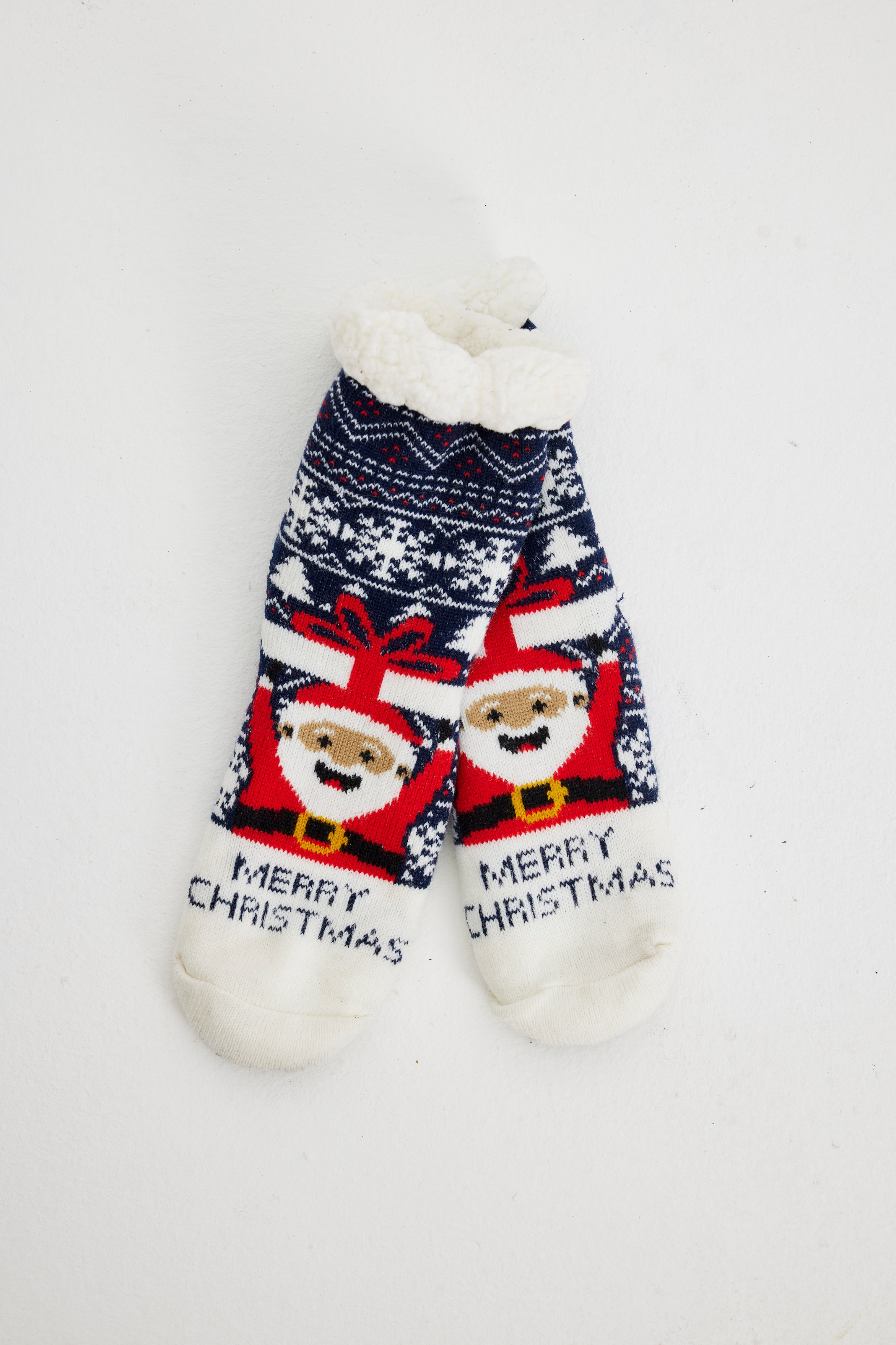 Et par behagelige julesokker med citatet 