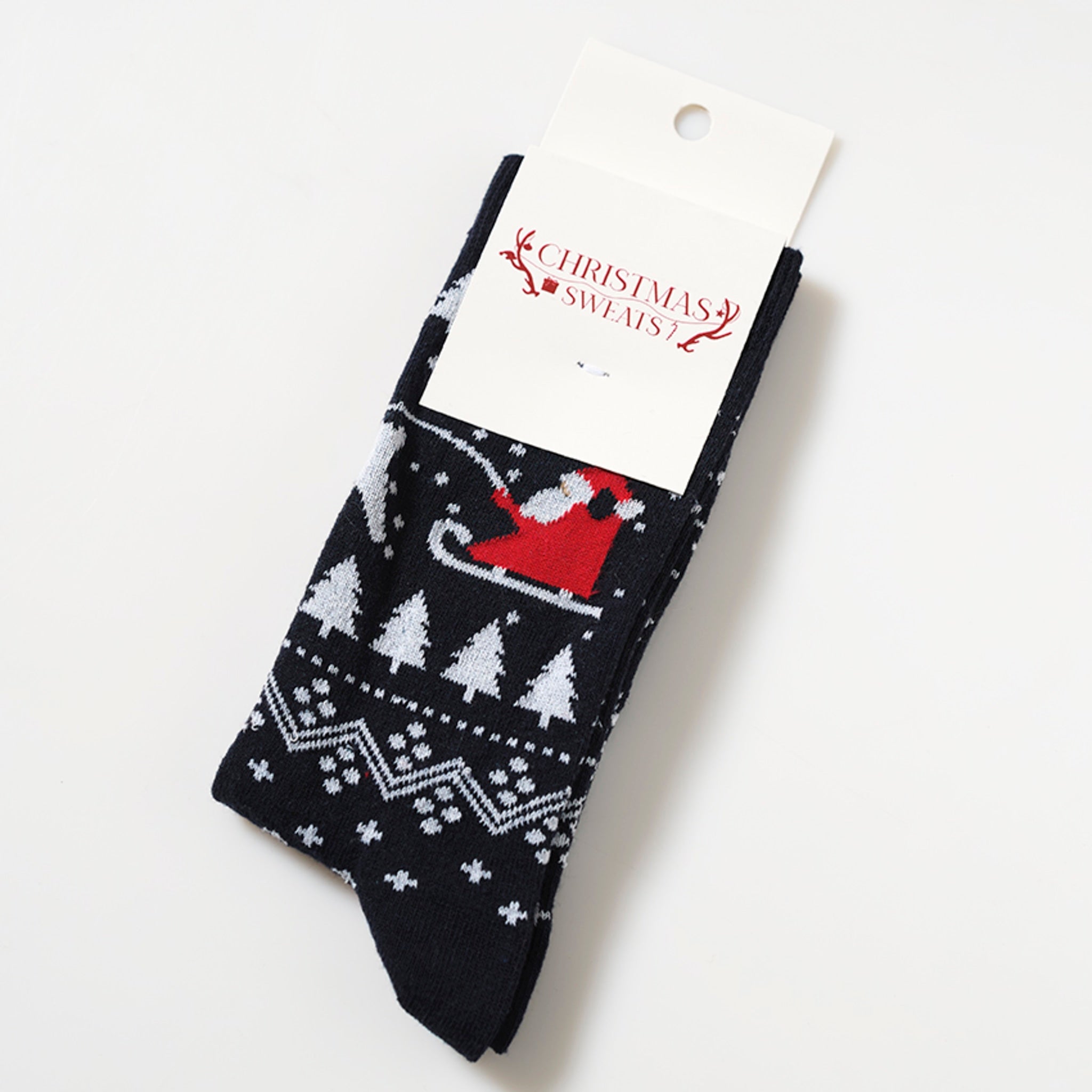Et par sorte julesokker med en julemand på.